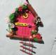 Miniature fairy house using icecream sticks and wood sticks